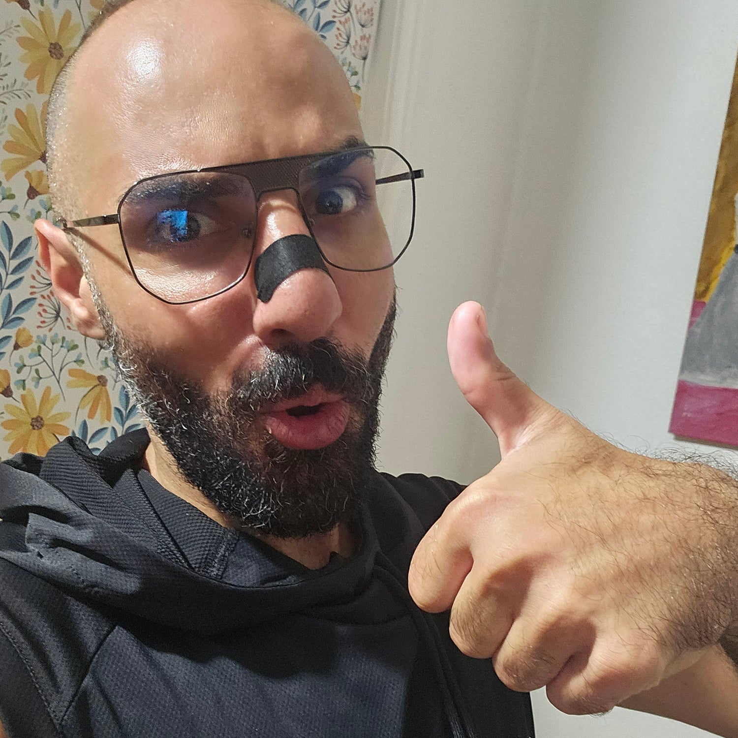 “Person using nasal strip to breathe better through the nose